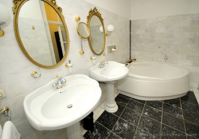 Luxury White hotel bathroom with two washbasins