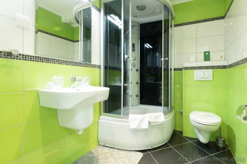 Interior of a modern bathroom with green walls