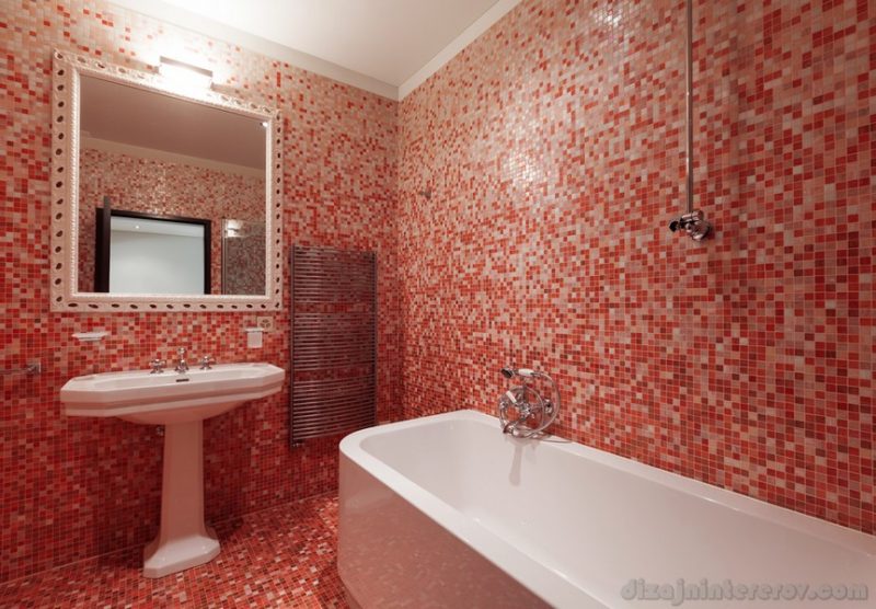 Bathroom with red tiles and a bathtub
